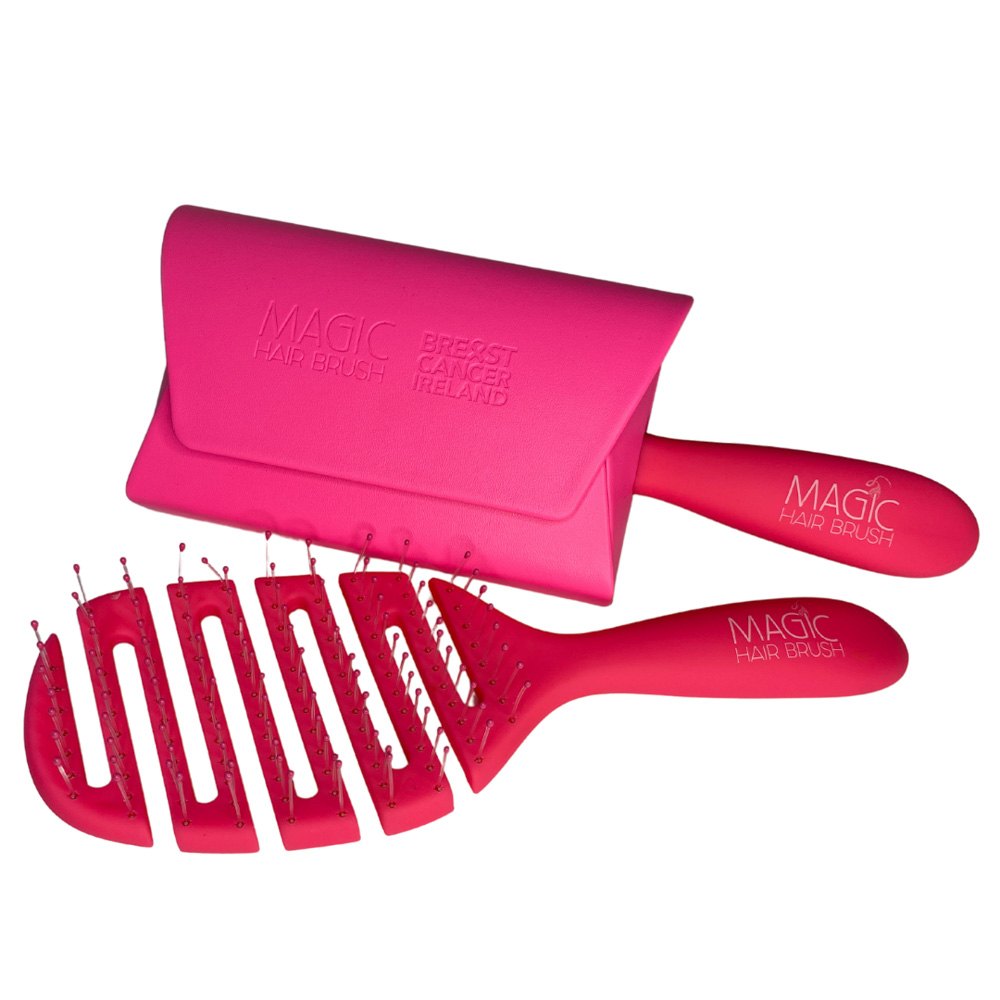 The hot pink limited edition brush beside its pink wallet, which is embossed Magic Hair Brush and Breast Cancer Ireland.